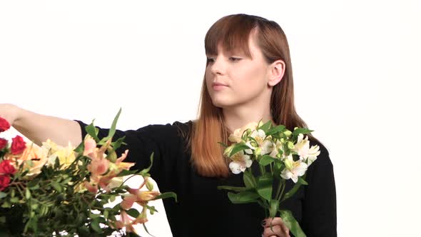 Florist Assemble a Bouquet of Flowers. White. Close Up