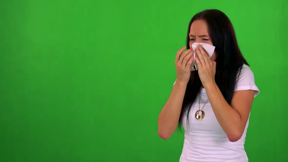 Young Pretty Woman Blow One's Nose - Green Screen - Studio