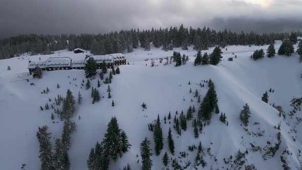 Aerial shot of chalet in the woods, winter landscape near Crater Lake, Oregon