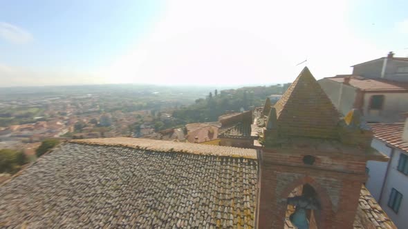 Aerial View Of The Comune Of Sinalunga In Siena, Italy With Ancient Churches On A Sunny Day - drone