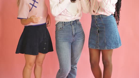 Three Young Women Friends of Different Race Posing Isolated on Bright Pink Wall Background