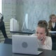Portrait of a Little Girl Talking on the Phone and Working on Laptop in Office - VideoHive Item for Sale