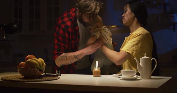 Young Parents Sharing Nighttime Feeding Duties