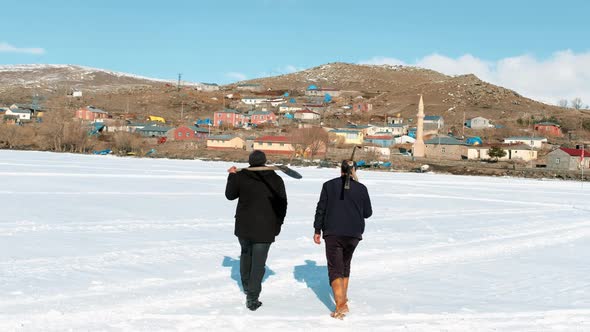 Peasant Men Walking on the Frozen Lake