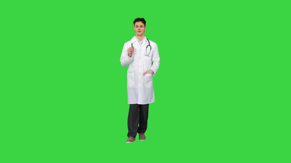 Orthopedist Talking To Camera and Dancing After Everything Will Be Fine on a Green Screen, Chroma