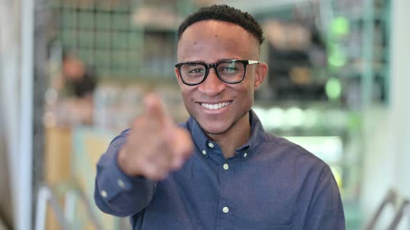 Happy Young African Man with Pointing with Finger 