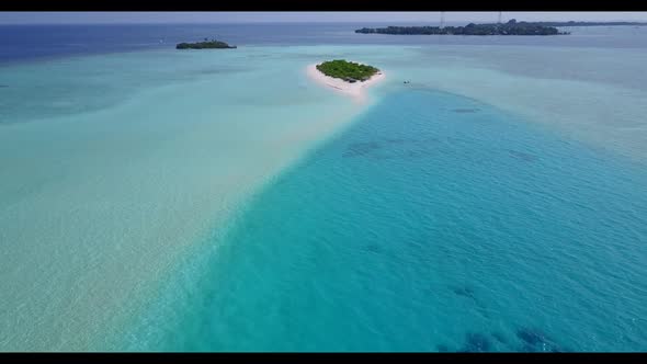 Aerial drone seascape of paradise coast beach holiday by blue green water and white sandy background
