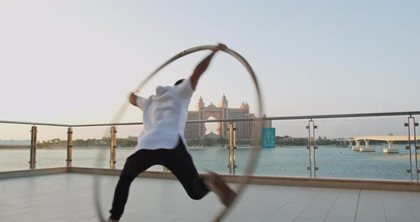 Beautiful Sunset View in the Background of a Man Doing Wheel Gymnastics