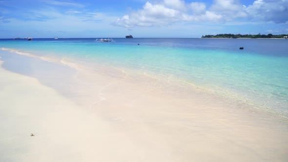 View of nice empty sandy beach, turquoise water in Lombok Beach