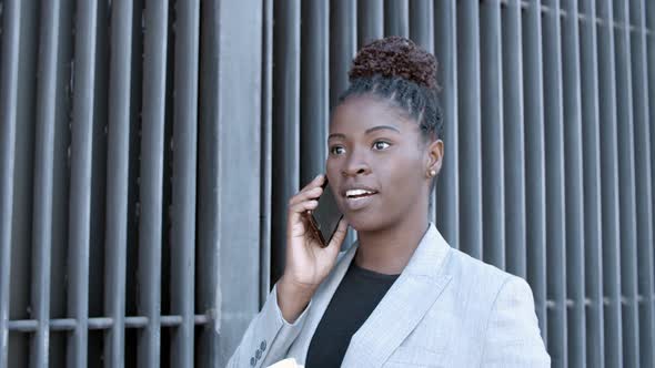 Confident Female Professional Speaking on Cellphone