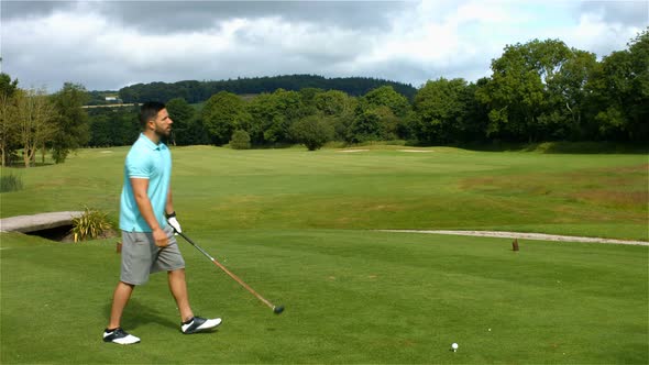 Focused man playing golf