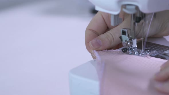 Sewing a rolled hem on a piece of fabric