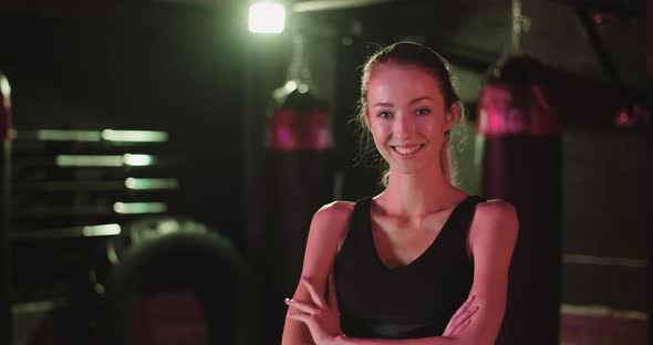 Portrait Of Smiling Female Athlete In Gym