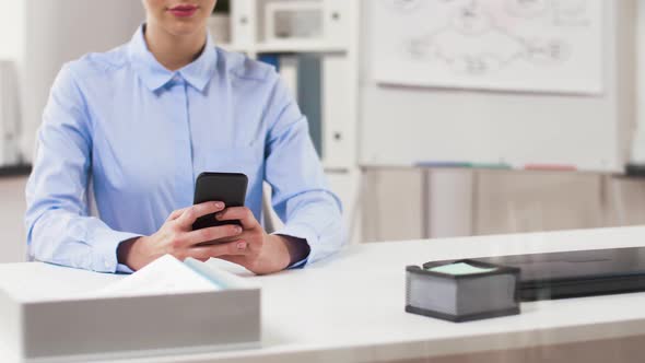 Businesswoman with Smartphone Working at Office 25