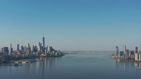 A drone view over the Hudson River early in the morning. The camera truck right over the calm river,