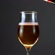 Pouring beer from the bottle into a rotating wine glass - VideoHive Item for Sale