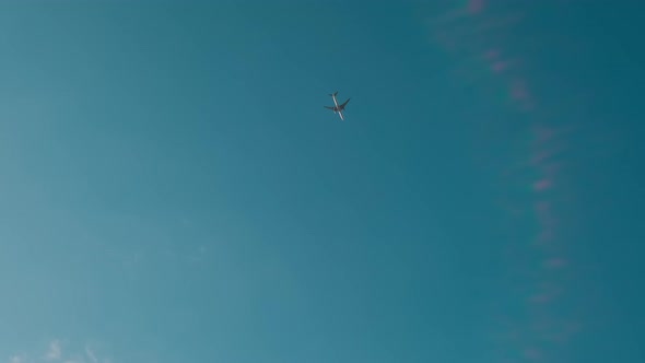 Airplane Fly Pass the Blue Sky Down to Up View