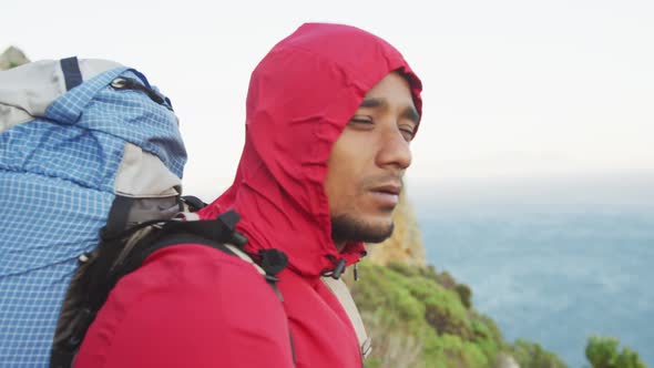 Sporty mixed race man with prosthetic leg hiking