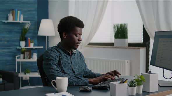 Confident Remote Worker Doing His Job From Home Taking a Sip of Coffee