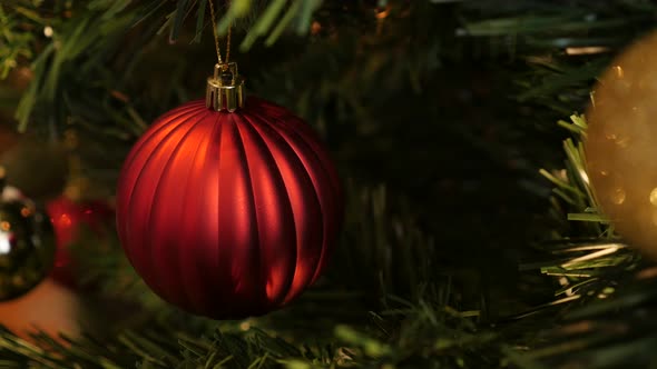 Detailed red Christmas tree decoration close-up 4K 2160p 30fps UltraHD footage - Decorative  bauble 