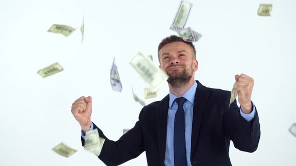 Slow Motion of Formally Dressed Man is Delighted with the Fact That a Lot of Dollar Bills are Fall