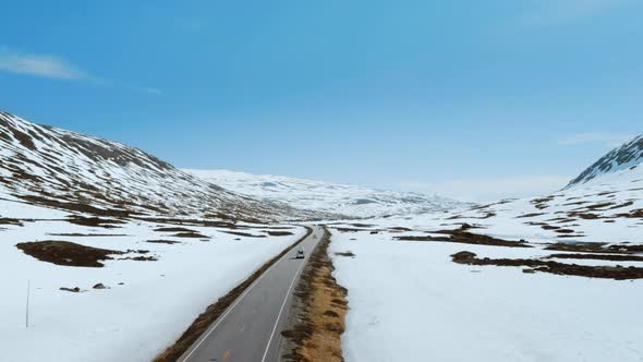 Small Vintage Camper RV on Mountain Road in Norway