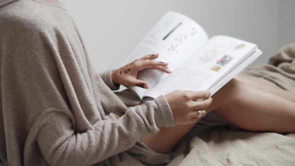 Reading a Journal Woman