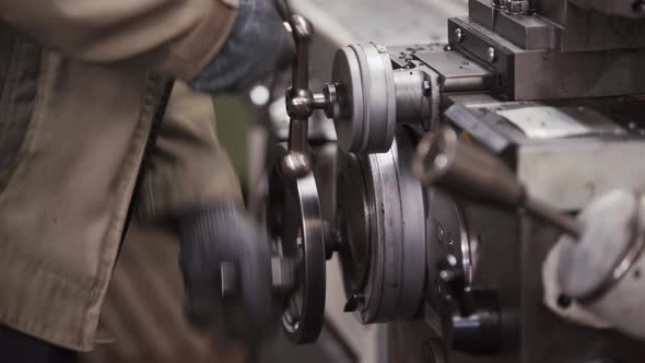 Turning Lathe in Action. Facing Operation of Metal Blank on Turning Machine with Cutting Tool