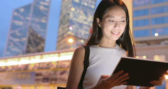 Business Woman Working on Digital Tablet in City at Night  