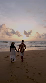 Phuket Thailand Couple Men and Woman Watching Sunset on the Beach of Phuket Thailand