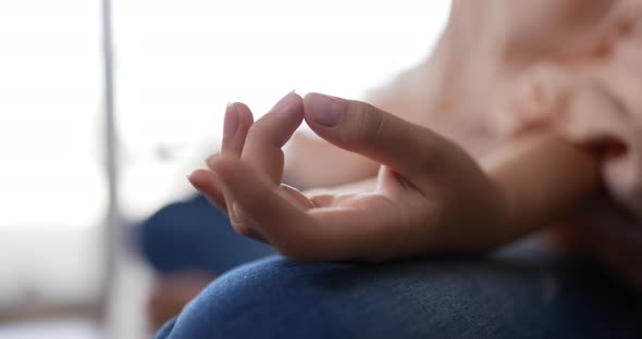 Hand woman meditating in lotus position sitting