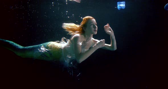 Mermaid Is Tangling in Plastic Rubbish Floating Underwater in Sea, Fairytale Characters