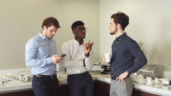 Business Team Sharing Experience While Drinking Tea