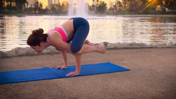 Woman Doing Yoga In The Park At Dawn