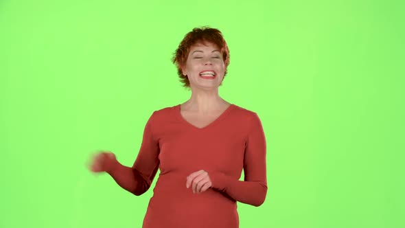 Redhaired Woman Talks About the Pros of the Goods. Green Screen