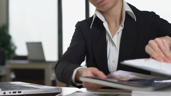 Female Secretary Reading Magazine Instead Work, Sitting at Office Desk, Laziness