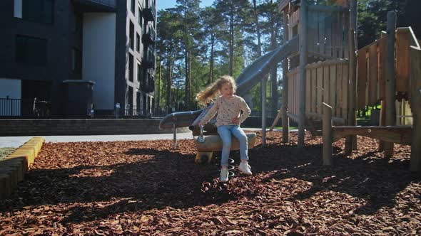 Happy Kids Playing at Playground Near with House