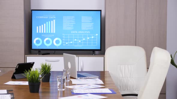 Empty Business Meeting Room with Big TV and Animated Data