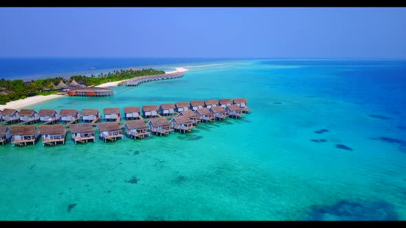 Aerial above scenery of marine bay beach vacation by aqua blue water and white sand background of a 