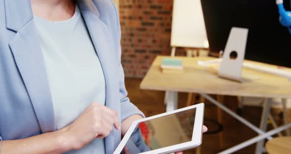 Female business executive using digital tablet