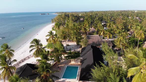 Paradise Coast Resort with Palm Trees and Hotels By Ocean Zanzibar Aerial View