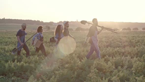 Young Hipster Farmers Walking Together