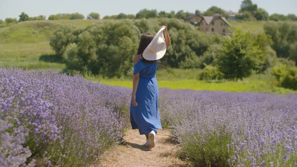 Joyful Female Running in Purple Lavender Field