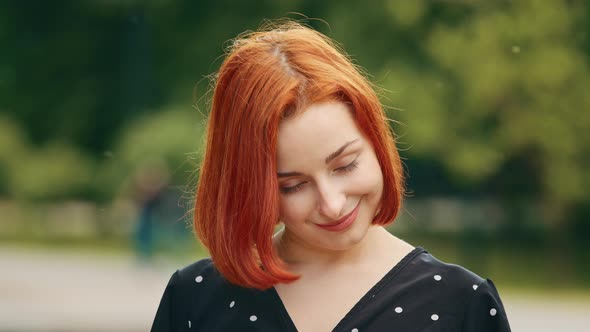 Close Up Outdoors Portrait of Human Female Face Caucasian Young Girl Redhead Woman Lady Smiling