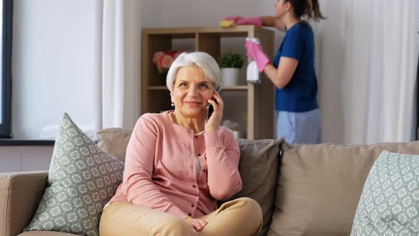 Happy Senior Woman Calling on Smartphone at Home