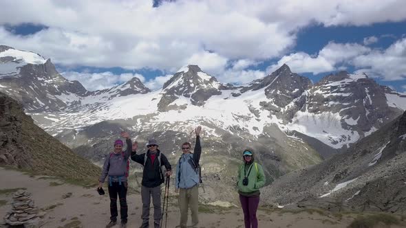 Tourists on a Pass in the Alps