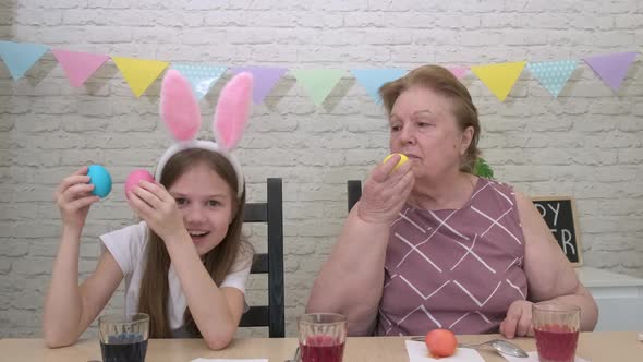 Little Girl with Her Grandmother Having Fun on Easter Day