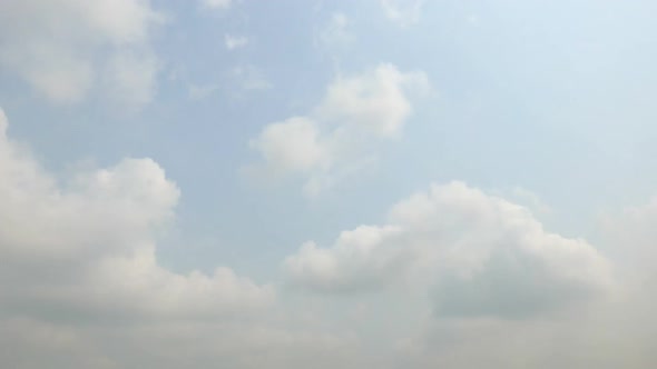 Time lapse of white cloud moving pass around sky background