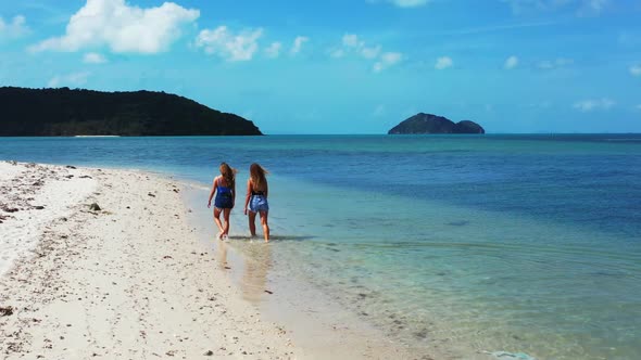 Girls best friends on perfect tourist beach wildlife by turquoise sea and white sand background of K