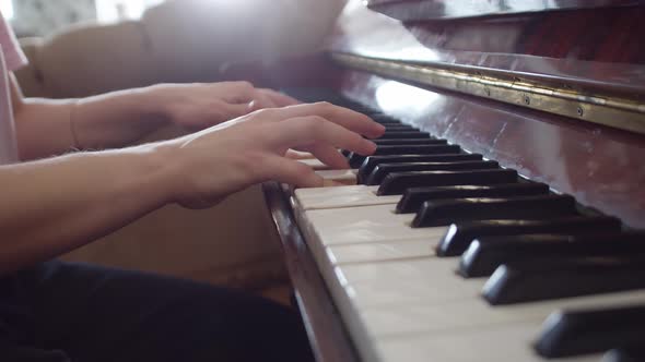 Woman Closeup Plays the Piano with Hands